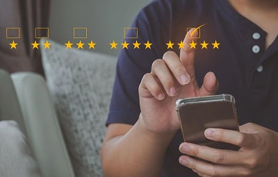 A customer giving feedback on his phone