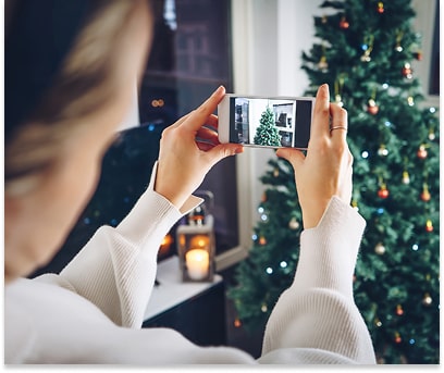 Woman taking festive pictures for a social media post