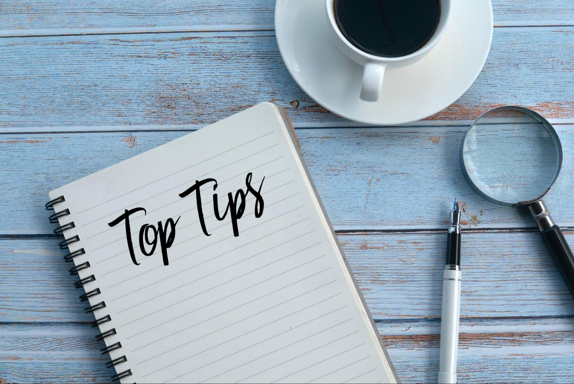 A notebook with 'Top Tips' written on it