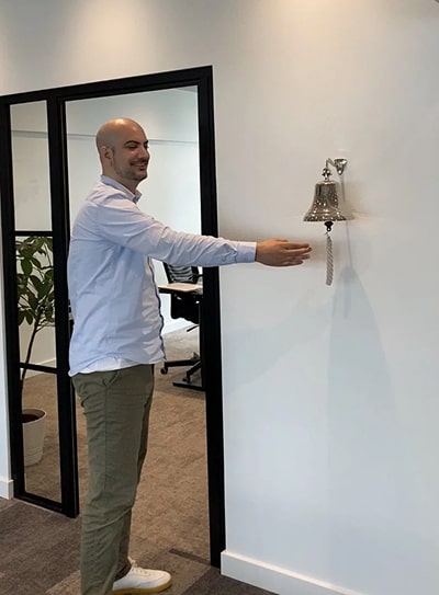 Johannes, global sales manager at Paperturn, ringing the sales bell